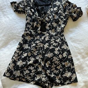 Romper with cut out in front.